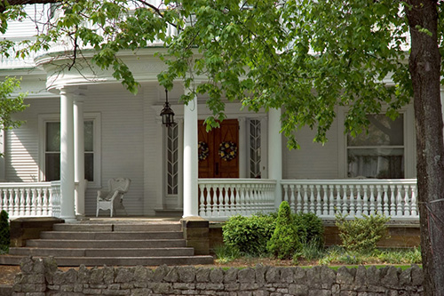 Front porch showing balusters, rails and columns